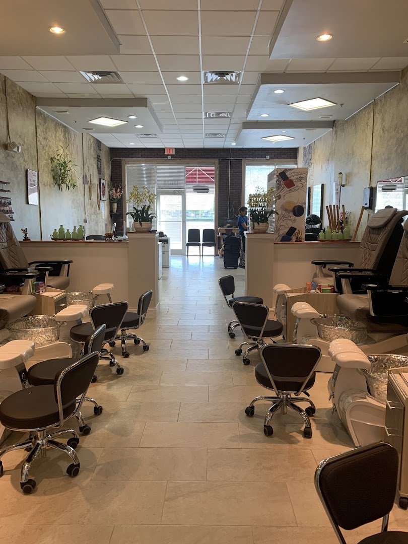 Pedicure station with polish bottles nearby.